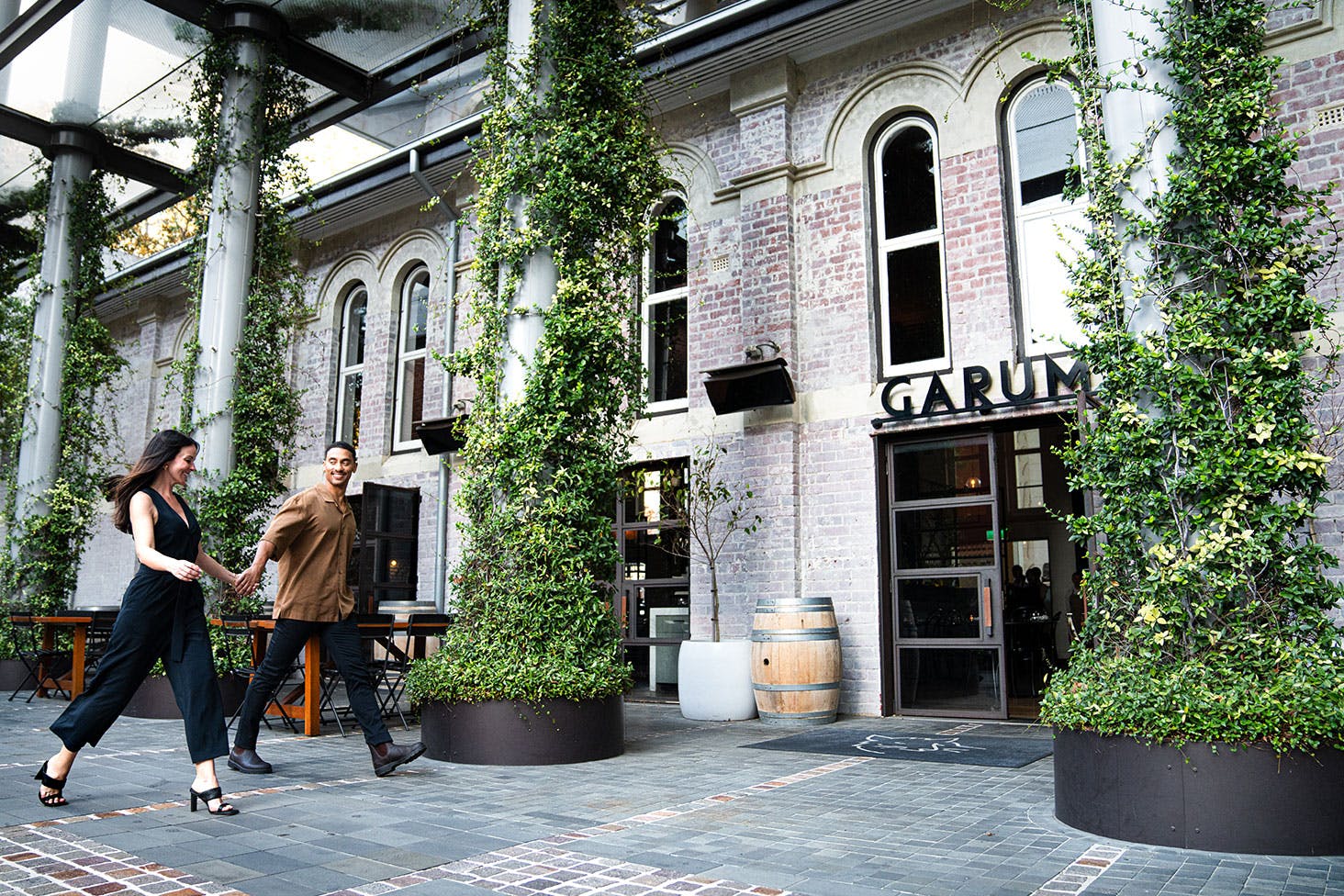 two people walking into a restaurant